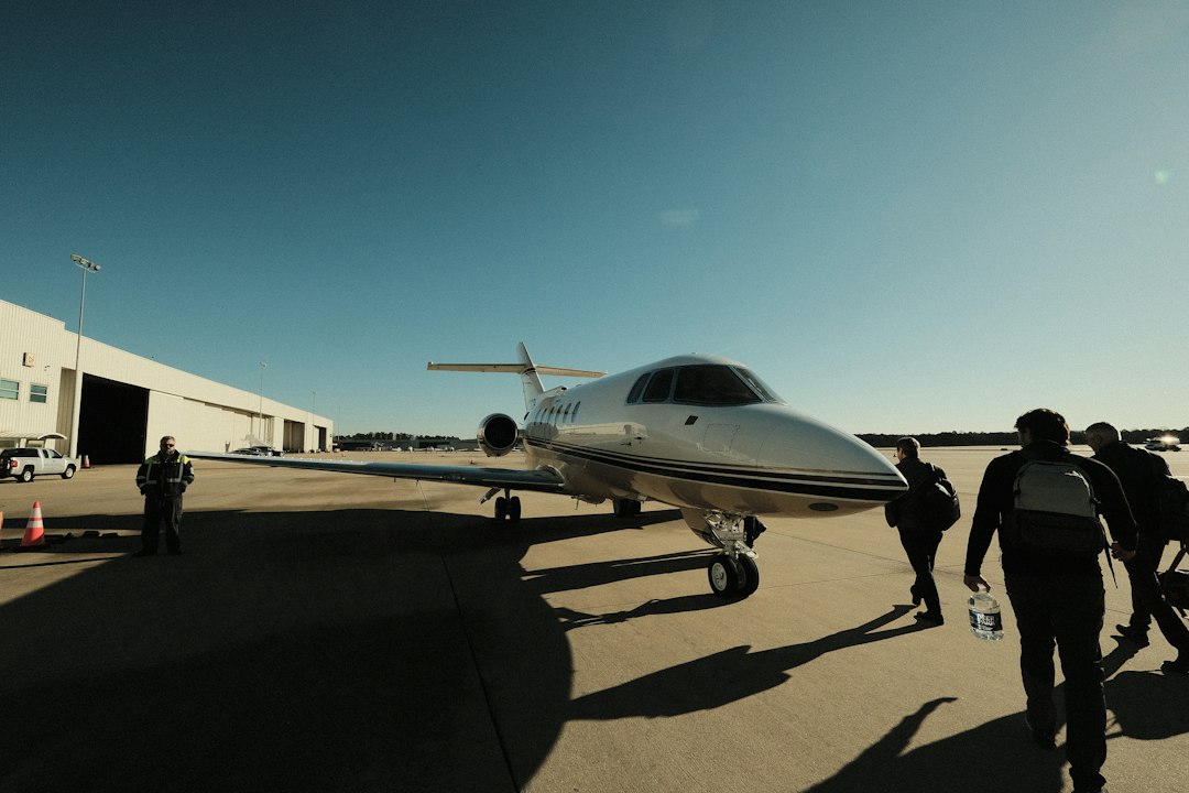 Commercial airline pilots and flight operations team on tarmac